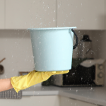 property insurance claims UK water leak bucket catching water from ceiling